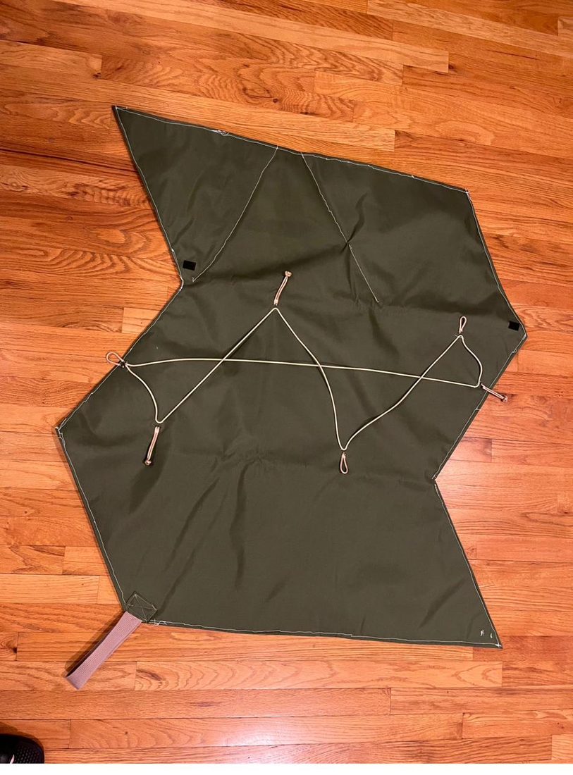 The Zong Zi opened out flat into a large olive blanket with cord anchor points.